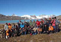 Group photo with a glacier lake in the back