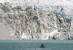 Study of a glacial lake at 5,000 m elevation. In addition to rowing out in a rubber dinghy to measure the water depth, the researchers checked for factors that cause lake outburst, studied the strength of the moraine and so on.