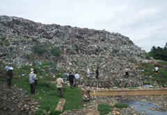 Field survey at open dump by SATREPS members
